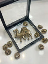 Decorative metal brooch set featuring a camel-shaped centerpiece and matching round buttons.