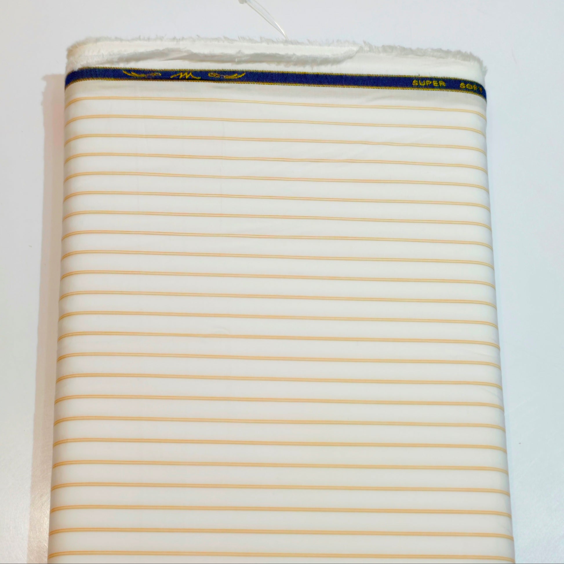 Roll of fabric with yellow stripes on a white background